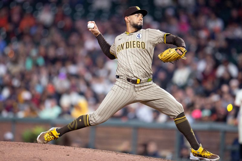 Jun 2, 2025; San Francisco, California, USA; San Diego Padres pitcher Robert Suarez (75) delivers a pitch against the San Francisco Giants during the ninth inning at Oracle Park. Mandatory Credit: D. Ross Cameron-Imagn Images