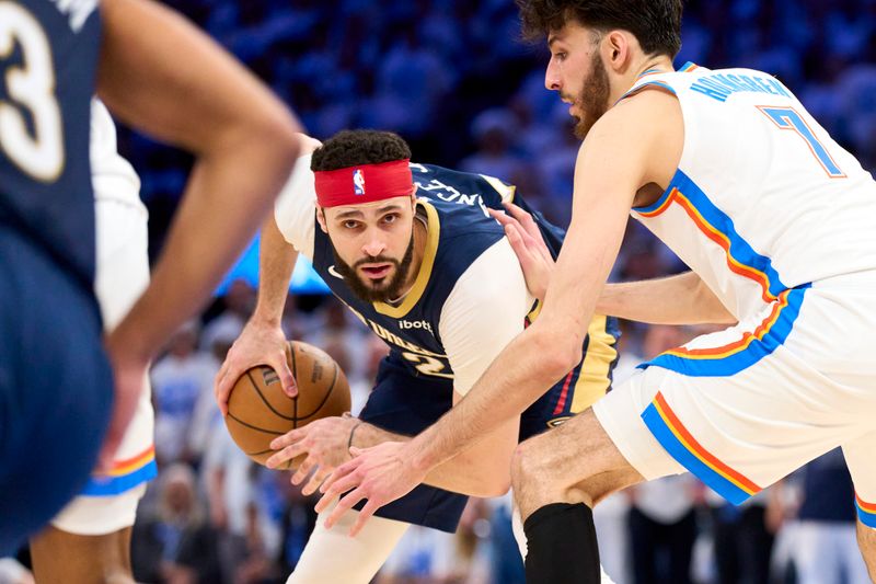 OKLAHOMA CITY, OKLAHOMA - APRIL 21: Larry Nance Jr. #22 of the New Orleans Pelicans brings the ball up court against the Oklahoma City Thunder in game one of the Western Conference First Round Playoffs at the Paycom Center on April 21, 2024 in Oklahoma City, Oklahoma. NOTE TO USER: User expressly acknowledges and agrees that, by downloading and or using this photograph, User is consenting to the terms and conditions of the Getty Images License Agreement.  (Photo by Cooper Neill/Getty Images)