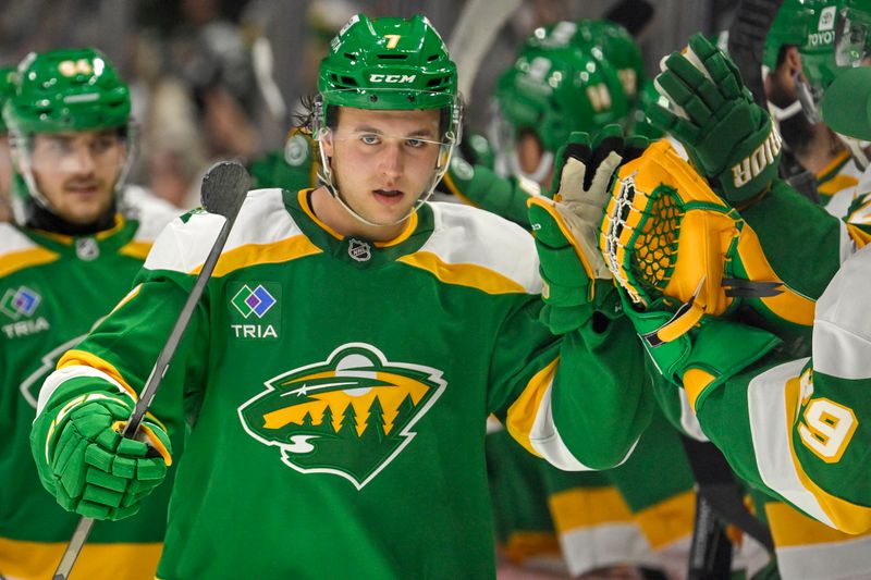 Nov 1, 2024; Saint Paul, Minnesota, USA;  Minnesota Wild defenseman Brock Faber (7) celebrates his goal against the Tampa Bay Lightning during the third period at Xcel Energy Center. Mandatory Credit: Nick Wosika-Imagn Images