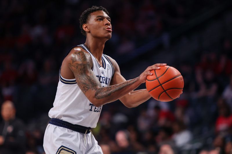 Feb 25, 2023; Atlanta, Georgia, USA; Georgia Tech Yellow Jackets forward Jalon Moore (14) shoots a free throw against Louisville Cardinals in the second half at McCamish Pavilion. Mandatory Credit: Brett Davis-USA TODAY Sports