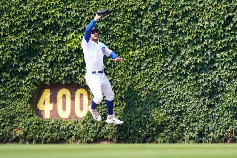 Jun 17, 2023; Chicago, Illinois, USA; Chicago Cubs center fielder Mike Tauchman (40) makes a catch on Baltimore Orioles first baseman Ryan O'Hearn (32) during the eighth inning at Wrigley Field. Mandatory Credit: David Banks-USA TODAY Sports