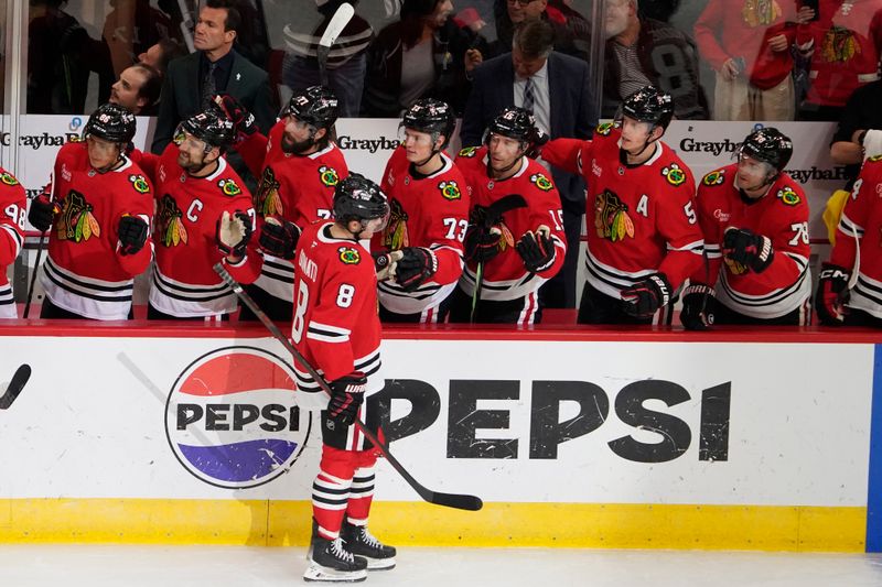 Oct 22, 2024; Chicago, Illinois, USA; Chicago Blackhawks center Ryan Donato (8) celebrates his goal against the Vancouver Canucks during the first period at United Center. Mandatory Credit: David Banks-Imagn Images