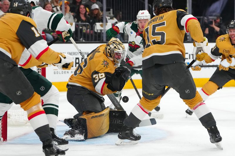 Apr 12, 2024; Las Vegas, Nevada, USA; Vegas Golden Knights goaltender Logan Thompson (36) makes a save against the Minnesota Wild during the first period at T-Mobile Arena. Mandatory Credit: Stephen R. Sylvanie-USA TODAY Sports