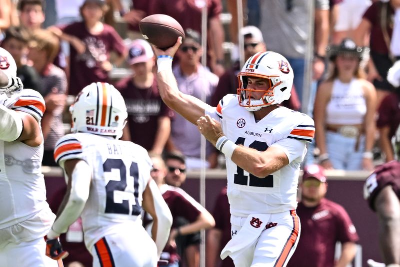 Sep 23, 2023; College Station, Texas, USA; Auburn Tigers quarterback Holden Geriner (12) passes the ball during the fourth quarter against the Texas A&M Aggies at Kyle Field. Mandatory Credit: Maria Lysaker-USA TODAY Sports