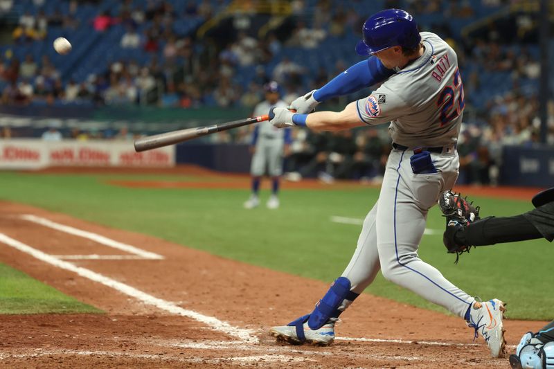May 3, 2024; St. Petersburg, Florida, USA;  New York Mets third base Brett Baty (22) hits a home run against the Tampa Bay Rays during the ninth inning at Tropicana Field. Mandatory Credit: Kim Klement Neitzel-USA TODAY Sports
