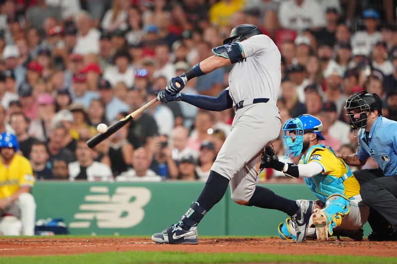 Jul 27, 2024; Boston, Massachusetts, USA; <p><br/></p>New York Yankees designated hitter Aaron Judge (99) hits an RBI single against the Boston Red Sox during the fifth inning at Fenway Park. Mandatory Credit: Gregory Fisher-USA TODAY Sports