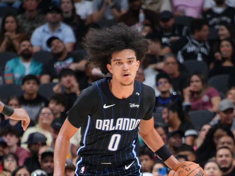 SAN ANTONIO, TX - OCTOBER 9: Anthony Black #00 of the Orlando Magic dribbles the ball during the game against the San Antonio Spurs during a NBA preseason game on October 9, 2024 at the Frost Bank Center in San Antonio, Texas. NOTE TO USER: User expressly acknowledges and agrees that, by downloading and or using this photograph, user is consenting to the terms and conditions of the Getty Images License Agreement. Mandatory Copyright Notice: Copyright 2024 NBAE (Photos by Michael Gonzales/NBAE via Getty Images)