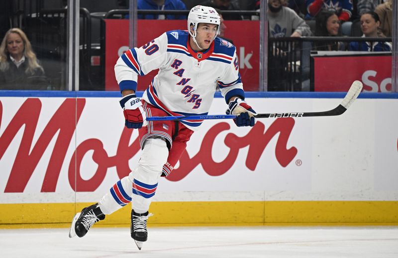Oct 16, 2025; Toronto, Ontario, CAN; New York Rangers forward Will Cuylle (50) pursues the play against the Toronto Maple Leafs in the first period at Scotiabank Arena. Mandatory Credit: Dan Hamilton-Imagn Images