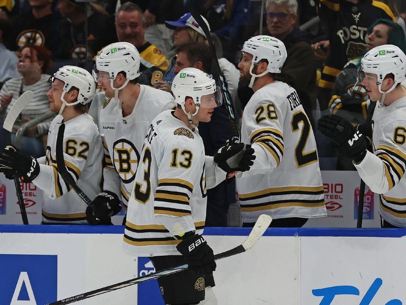 Nov 20, 2023; Tampa, Florida, USA; Boston Bruins center Charlie Coyle (13) is congratulated after he scored against the Tampa Bay Lightning during the third period at Amalie Arena. Mandatory Credit: Kim Klement Neitzel-USA TODAY Sports