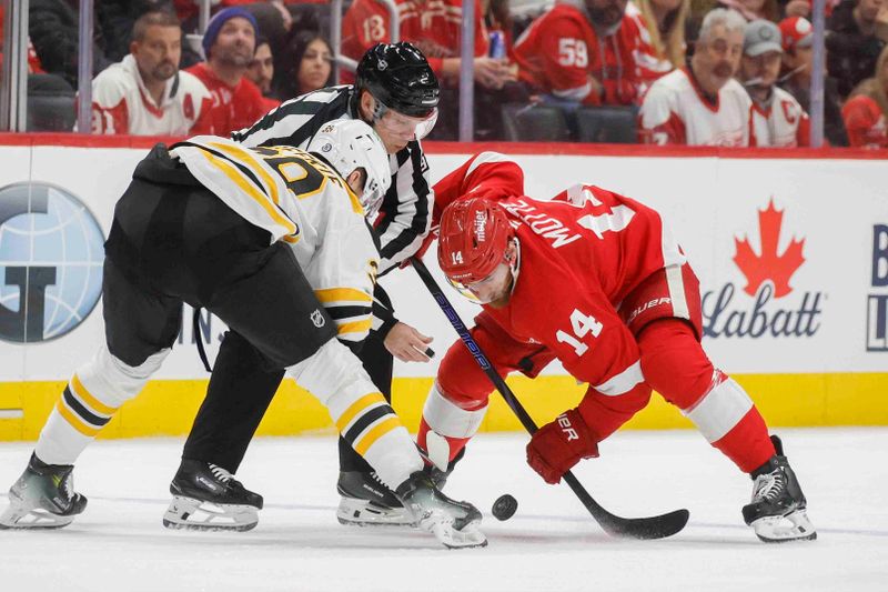 Nov 23, 2024; Detroit, Michigan, USA; Detroit Red Wings center Tyler Motte (14) faces off against Boston Bruins center Morgan Geekie (39) at Little Caesars Arena. Mandatory Credit: Brian Bradshaw Sevald-Imagn Images