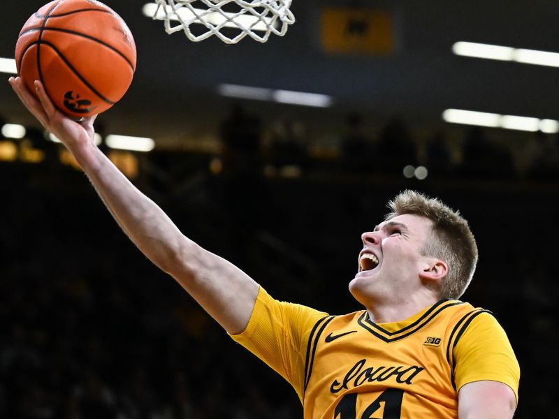 Feb 25, 2026; Iowa City, Iowa, USA; Iowa Hawkeyes guard Bennett Stirtz (14) goes to the basket against the Ohio State Buckeyes during the second half at Carver-Hawkeye Arena. Mandatory Credit: Jeffrey Becker-Imagn Images Feb 25, 2026; Iowa City, Iowa, USA; Iowa Hawkeyes guard Bennett Stirtz (14) goes to the basket against the Ohio State Buckeyes during the second half at Carver-Hawkeye Arena. Mandatory Credit: Jeffrey Becker-Imagn Images