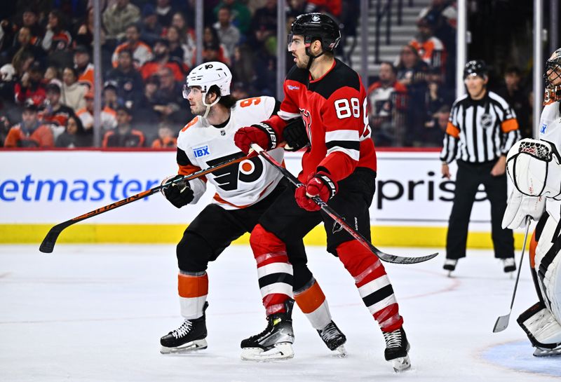 Apr 13, 2024; Philadelphia, Pennsylvania, USA; Philadelphia Flyers defenseman Jamie Drysdale (9) and New Jersey Devils defenseman Kevin Bahl (88) battle for position in the second period at Wells Fargo Center. Mandatory Credit: Kyle Ross-USA TODAY Sports