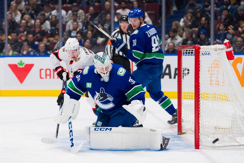 Jan 2, 2024; Vancouver, British Columbia, CAN; Vancouver Canucks goalie Thatcher Demko (35) makes a save on Ottawa Senators forward Brady Tkachuk (7) in the first  period at Rogers Arena. Mandatory Credit: Bob Frid-USA TODAY Sports