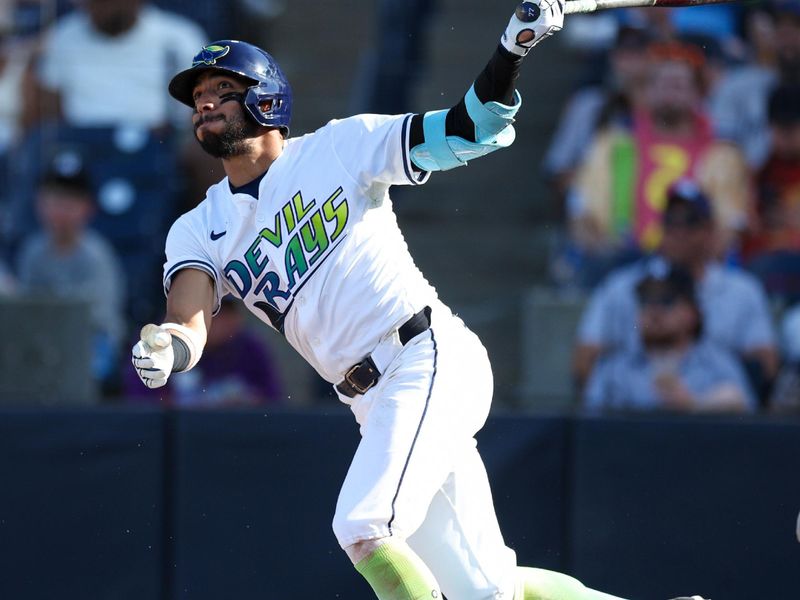 Apr 19, 2025; Tampa, Florida, USA; Tampa Bay Rays shortstop Jose Caballero (77) doubles against the New York Yankees in the fourth inning at George M. Steinbrenner Field. Mandatory Credit: Nathan Ray Seebeck-Imagn Images