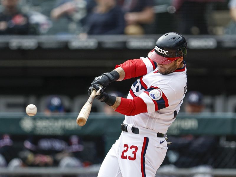 Sep 17, 2023; Chicago, Illinois, USA; Chicago White Sox left fielder Andrew Benintendi (23) singles against the Minnesota Twins during the first inning at Guaranteed Rate Field. Mandatory Credit: Kamil Krzaczynski-USA TODAY Sports