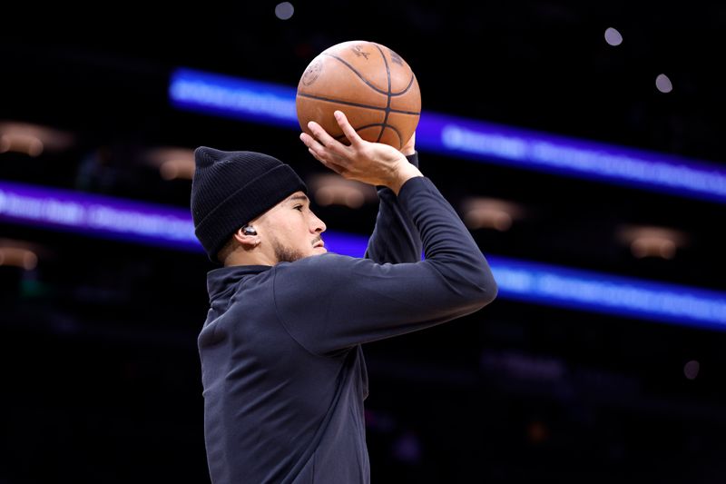 PHOENIX, ARIZONA - OCTOBER 16: Devin Booker #1 of the Phoenix Suns prepares for the game against the Portland Trail Blazers at Footprint Center on October 16, 2023 in Phoenix, Arizona. NOTE TO USER: User expressly acknowledges and agrees that, by downloading and or using this photograph, User is consenting to the terms and conditions of the Getty Images License Agreement. (Photo by Chris Coduto/Getty Images)