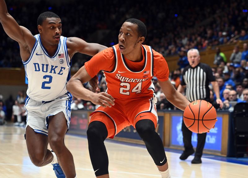 Jan 2, 2024; Durham, North Carolina, USA; Syracuse Orange guard Quadir Copeland (24) controls the ball in front of Duke Blue Devils guard Jaylen Blakes (2) during the first half at Cameron Indoor Stadium. Mandatory Credit: Rob Kinnan-USA TODAY Sports