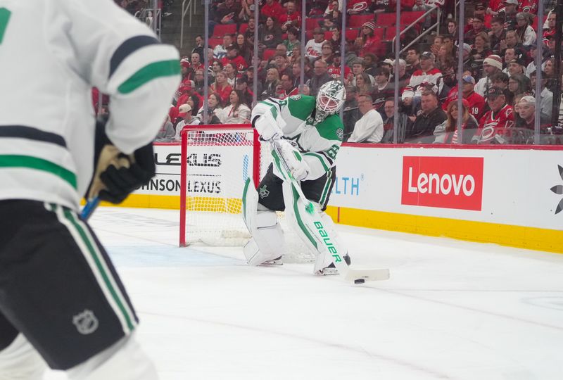 Nov 25, 2024; Raleigh, North Carolina, USA;  Dallas Stars goaltender Jake Oettinger (29) comes out to play the puck against the Carolina Hurricanes during the first period at Lenovo Center. Mandatory Credit: James Guillory-Imagn Images