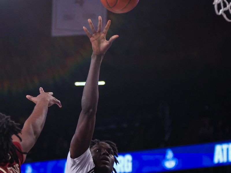 Jan 4, 2025; Atlanta, Georgia, USA; Georgia Tech Yellow Jackets forward Baye Ndongo (11) shoots against the Boston College Eagles in the second half at McCamish Pavilion. Mandatory Credit: Brett Davis-Imagn Images
