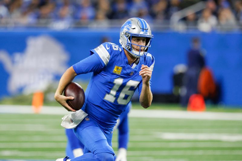 Detroit Lions quarterback Jared Goff (16) runs the ball against the Jacksonville Jaguars during the second half of an NFL football game, Sunday, Nov. 17, 2024, in Detroit. (AP Photo/Duane Burleson)