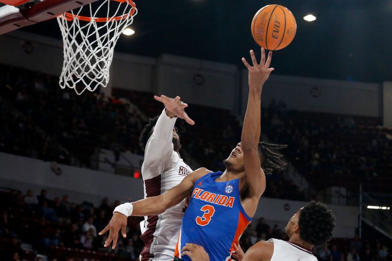 Jan 21, 2023; Starkville, Mississippi, USA; Florida Gators forward Alex Fudge (3) shoots during the first half against the Mississippi State Bulldogs at Humphrey Coliseum. Mandatory Credit: Petre Thomas-USA TODAY Sports