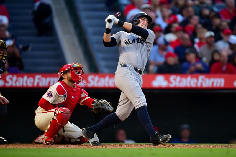 May 27, 2025; Anaheim, California, USA; New York Yankees designated hitter Ben Rice (22) hits a solo home run against the Los Angeles Angels during the fourth inning at Angel Stadium. Mandatory Credit: Gary A. Vasquez-Imagn Images
