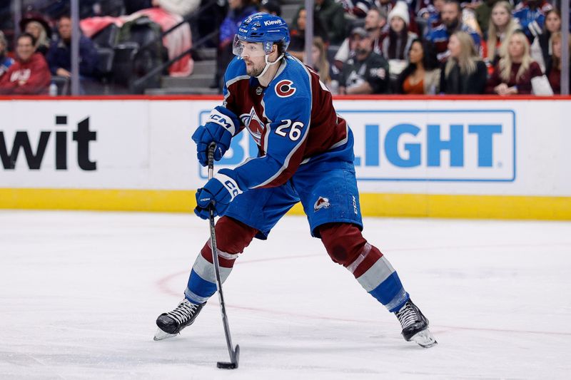 Nov 7, 2023; Denver, Colorado, USA; Colorado Avalanche center Ondrej Pavel (26) controls the puck in the third period against the New Jersey Devils at Ball Arena. Mandatory Credit: Isaiah J. Downing-USA TODAY Sports