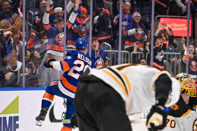 Nov 27, 2024; Elmont, New York, USA;  New York Islanders center Brock Nelson (29) celebrates his second goal of the game against the Boston Bruins during the second period at UBS Arena. Mandatory Credit: Dennis Schneidler-Imagn Images