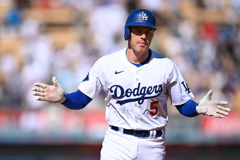 Jul 21, 2024; Los Angeles, California, USA; Los Angeles Dodgers first baseman Freddie Freeman (5) celebrates after hitting a home run against the Boston Red Sox during the first inning at Dodger Stadium. Mandatory Credit: Jonathan Hui-USA TODAY Sports