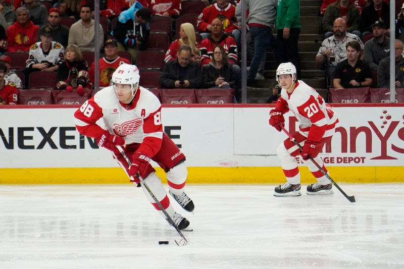 Nov 6, 2024; Chicago, Illinois, USA; Detroit Red Wings right wing Patrick Kane (88) moves the puck against the Chicago Blackhawks during the second period at United Center. Mandatory Credit: David Banks-Imagn Images