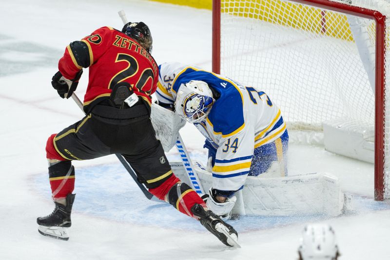 Dec 23, 2025; Ottawa, Ontario, CAN; Buffalo Sabres goalie Alex Lyon (34) makes a save on a shot from Ottawa Senators left wing Fabian Zetterlund (20) in the third period at the Canadian Tire Centre. Mandatory Credit: Marc DesRosiers-IMAGN Images