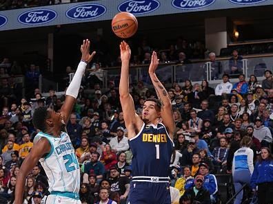 DENVER, CO - JANUARY 1: Michael Porter Jr. #1 of the Denver Nuggets shoots the ball during the game against the Charlotte Hornets on January 1, 2024 at the Ball Arena in Denver, Colorado. NOTE TO USER: User expressly acknowledges and agrees that, by downloading and/or using this Photograph, user is consenting to the terms and conditions of the Getty Images License Agreement. Mandatory Copyright Notice: Copyright 2024 NBAE (Photo by Bart Young/NBAE via Getty Images)