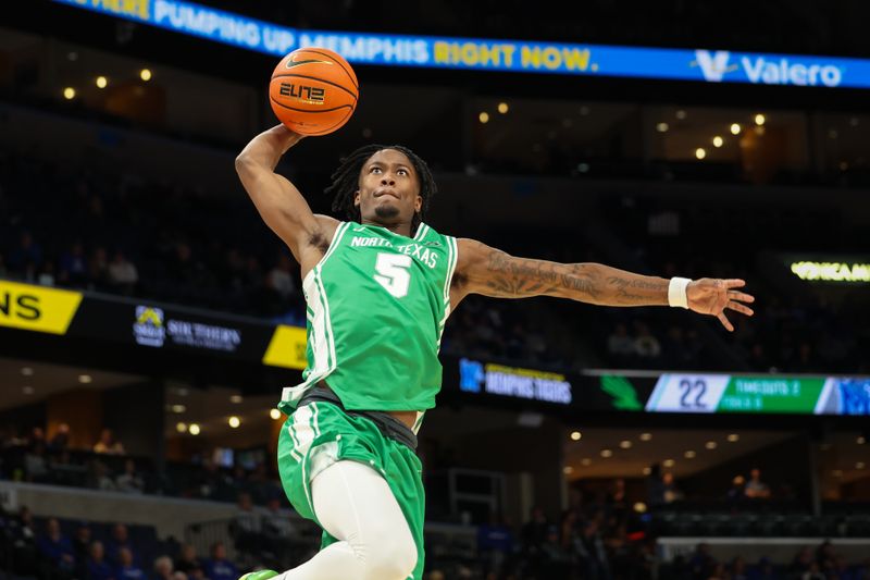 Dec 31, 2025; Memphis, Tennessee, USA; North Texas Mean Green guard David Terrell Jr. (5) dunks the ball against the Memphis Tigers during the second half at FedExForum. Mandatory Credit: Wesley Hale-Imagn Images