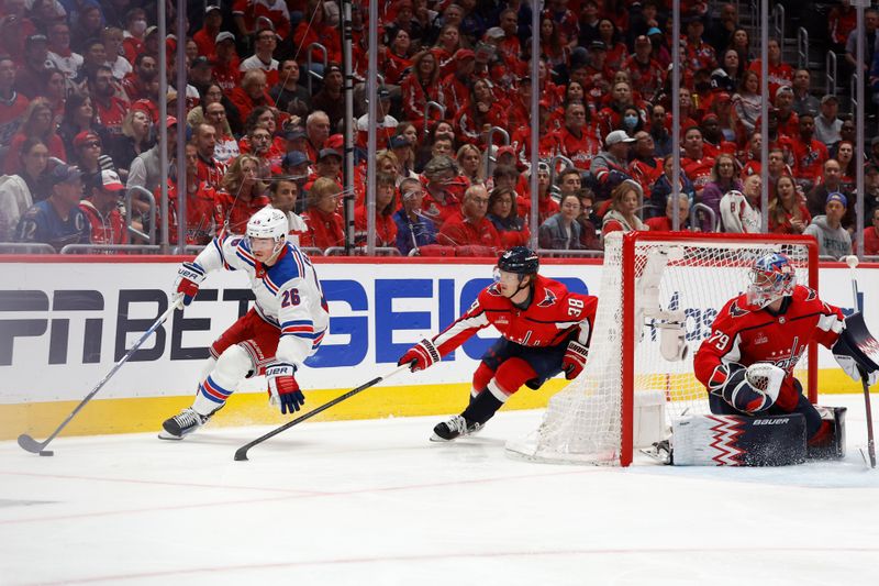 Apr 28, 2024; Washington, District of Columbia, USA; New York Rangers left wing Jimmy Vesey (26) skates with the puck behind Washington Capitals goaltender Charlie Lindgren (79) as Capitals defenseman Rasmus Sandin (38) chases in the second period in game four of the first round of the 2024 Stanley Cup Playoffs at Capital One Arena. Mandatory Credit: Geoff Burke-USA TODAY Sports