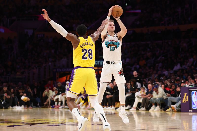 LOS ANGELES, CALIFORNIA - NOVEMBER 13: Luke Kennard #10 of the Memphis Grizzlies shoots the ball against Rui Hachimura #28 of the Los Angeles Lakers during the third quarter at Crypto.com Arena on November 13, 2024 in Los Angeles, California. NOTE TO USER: User expressly acknowledges and agrees that, by downloading and or using this photograph, User is consenting to the terms and conditions of the Getty Images License Agreement.  (Photo by Harry How/Getty Images)