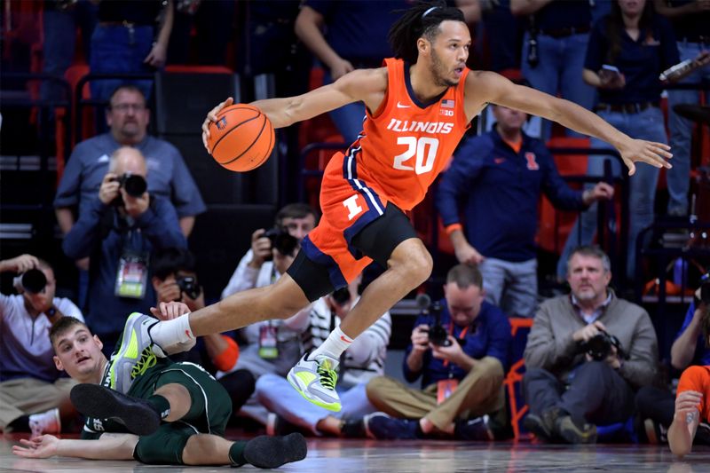 Jan 11, 2024; Champaign, Illinois, USA;  Illinois Fighting Illini forward Ty Rodgers (20) drives past Michigan State Spartans center Carson Cooper (15) on the floor, during the second half at State Farm Center. Mandatory Credit: Ron Johnson-USA TODAY Sports