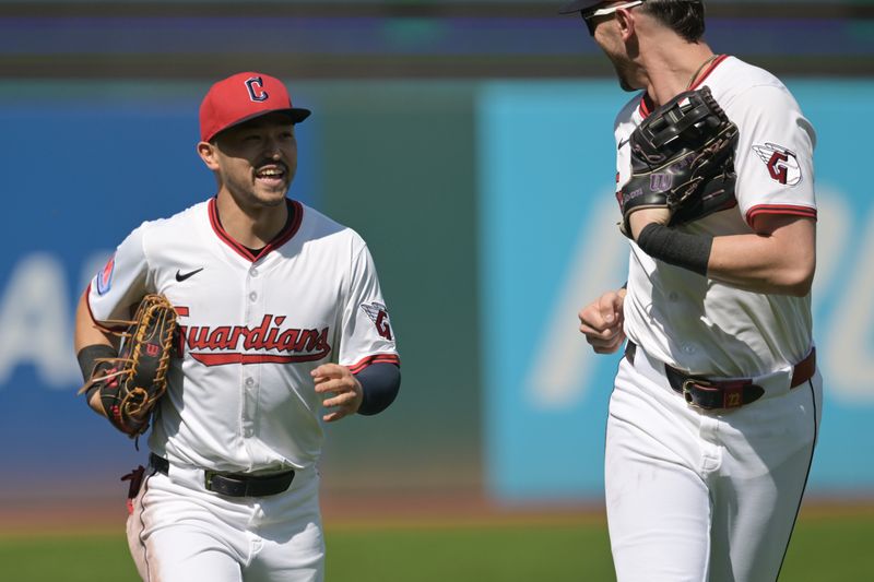 Sep 14, 2025; Cleveland, Ohio, USA; Cleveland Guardians left fielder Steven Kwan (38) runs off the field with center fielder Nolan Jones (22) after catching a ball against the wall hit by Chicago White Sox left fielder Will Robertson (not pictured) during the second inning at Progressive Field. Mandatory Credit: Ken Blaze-Imagn Images