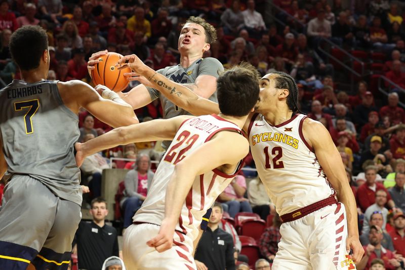 Feb 24, 2024; Ames, Iowa, USA; West Virginia Mountaineers center Jesse Edwards (7) drives the lane against the Iowa State Cyclones during the second half at James H. Hilton Coliseum. Mandatory Credit: Reese Strickland-USA TODAY Sports