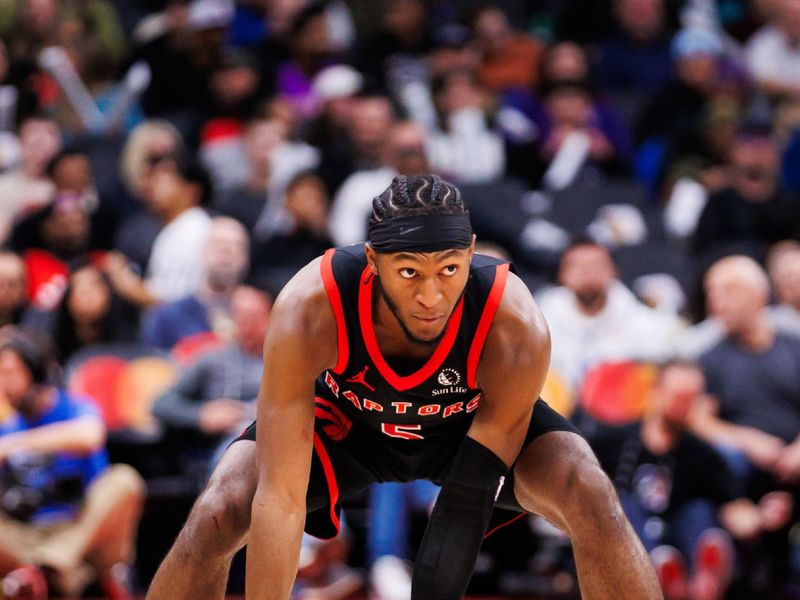 TORONTO, CANADA - JANUARY 3: Immanuel Quickley #5 of the Toronto Raptors takes the ball up the court against the Orlando Magic during the second half of their NBA game at Scotiabank Arena on January 3, 2025 in Toronto, Canada. NOTE TO USER: User expressly acknowledges and agrees that, by downloading and or using this photograph, User is consenting to the terms and conditions of the Getty Images License Agreement. (Photo by Cole Burston/Getty Images)