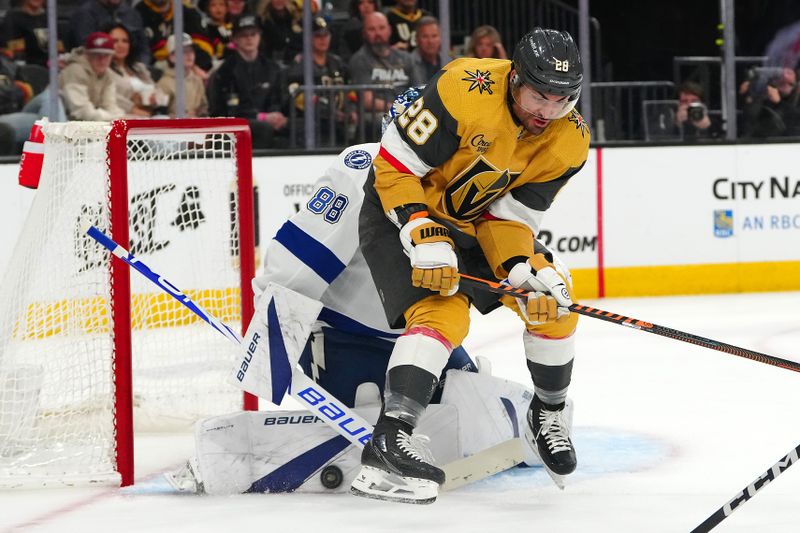 Mar 19, 2024; Las Vegas, Nevada, USA; Tampa Bay Lightning goaltender Andrei Vasilevskiy (88) makes a save as Vegas Golden Knights left wing William Carrier (28) screens him during the second period at T-Mobile Arena. Mandatory Credit: Stephen R. Sylvanie-USA TODAY Sports