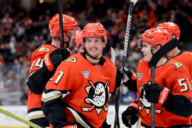 Nov 22, 2024; Anaheim, California, USA; Anaheim Ducks center Isac Lundestrom (21) celebrates with teammates after scoring against the Buffalo Sabres during the second period at Honda Center. Mandatory Credit: Ryan Sun-Imagn Images