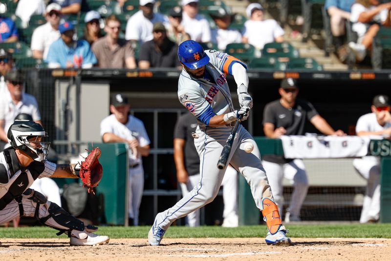 Sep 1, 2024; Chicago, Illinois, USA; New York Mets outfielder Starling Marte (6) hits an RBI-double against the Chicago White Sox during the ninth inning at Guaranteed Rate Field. Mandatory Credit: Kamil Krzaczynski-USA TODAY Sports