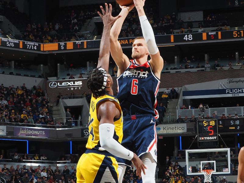 INDIANAPOLIS, IN - DECEMBER 9: Kristaps Porzingis #6 of the Washington Wizards shoots the ball during the game against the Indiana Pacers on December 9, 2022 at Gainbridge Fieldhouse in Indianapolis, Indiana. NOTE TO USER: User expressly acknowledges and agrees that, by downloading and or using this Photograph, user is consenting to the terms and conditions of the Getty Images License Agreement. Mandatory Copyright Notice: Copyright 2022 NBAE (Photo by Ron Hoskins/NBAE via Getty Images)