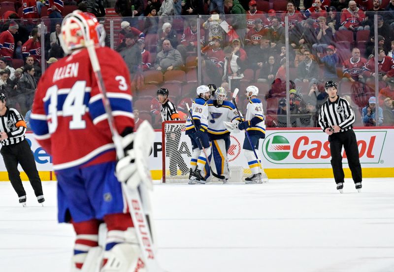 Feb 11, 2024; Montreal, Quebec, CAN; St.Louis Blues goalie Jordan Binnington (50) celebrates the win against Montreal Canadiens goalie Jake Allen (34) and the Camdadiens at the Bell Centre. Mandatory Credit: Eric Bolte-USA TODAY Sports