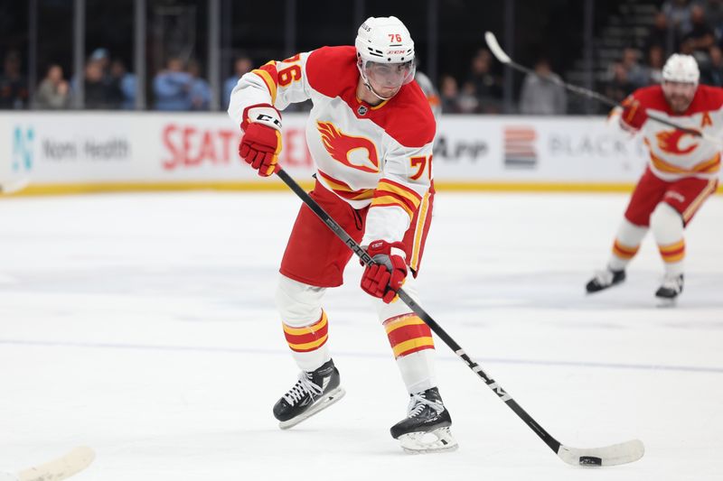 Oct 30, 2024; Salt Lake City, Utah, USA; Calgary Flames center Martin Pospisil (76) takes a breakaway shot against the Utah Hockey Club during the first period at Delta Center. Mandatory Credit: Rob Gray-Imagn Images