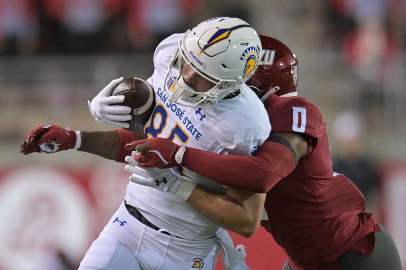 Sep 20, 2024; Pullman, Washington, USA; San Jose State Spartans tight end Jackson Canaan (85) is caught from behind by Washington State Cougars linebacker Taariq Al-Uqdah (0) in the first half at Gesa Field at Martin Stadium. Mandatory Credit: James Snook-Imagn Images