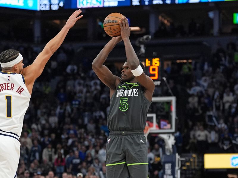 MINNEAPOLIS, MN - NOVEMBER 1: Anthony Edwards #5 of the Minnesota Timberwolves shoots a three point basket during the game against the Denver Nuggets on November 1, 2024 at Target Center in Minneapolis, Minnesota. NOTE TO USER: User expressly acknowledges and agrees that, by downloading and or using this Photograph, user is consenting to the terms and conditions of the Getty Images License Agreement. Mandatory Copyright Notice: Copyright 2024 NBAE (Photo by Jordan Johnson/NBAE via Getty Images)