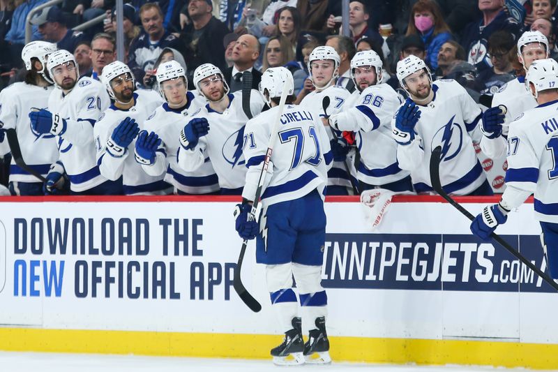 Jan 6, 2023; Winnipeg, Manitoba, CAN;  Tampa Bay Lightning forward Anthony Cirelli (71) is congratulated by his team mates on his goal against the Winnipeg Jets during the first period at Canada Life Centre. Mandatory Credit: Terrence Lee-USA TODAY Sports