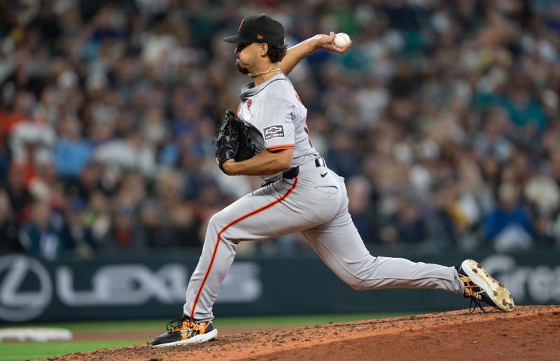 Aug 23, 2024; Seattle, Washington, USA; San Francisco Giants reliever Jordan Hicks (12) delivers a pitch during the seventh inning against the Seattle Mariners at T-Mobile Park. Mandatory Credit: Stephen Brashear-USA TODAY Sports