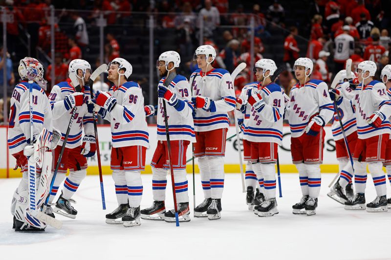 Apr 26, 2024; Washington, District of Columbia, USA; New York Rangers goaltender Igor Shesterkin (31) celebrates with teammates after their game against the Washington Capitals in game three of the first round of the 2024 Stanley Cup Playoffs at Capital One Arena. Mandatory Credit: Geoff Burke-USA TODAY Sports